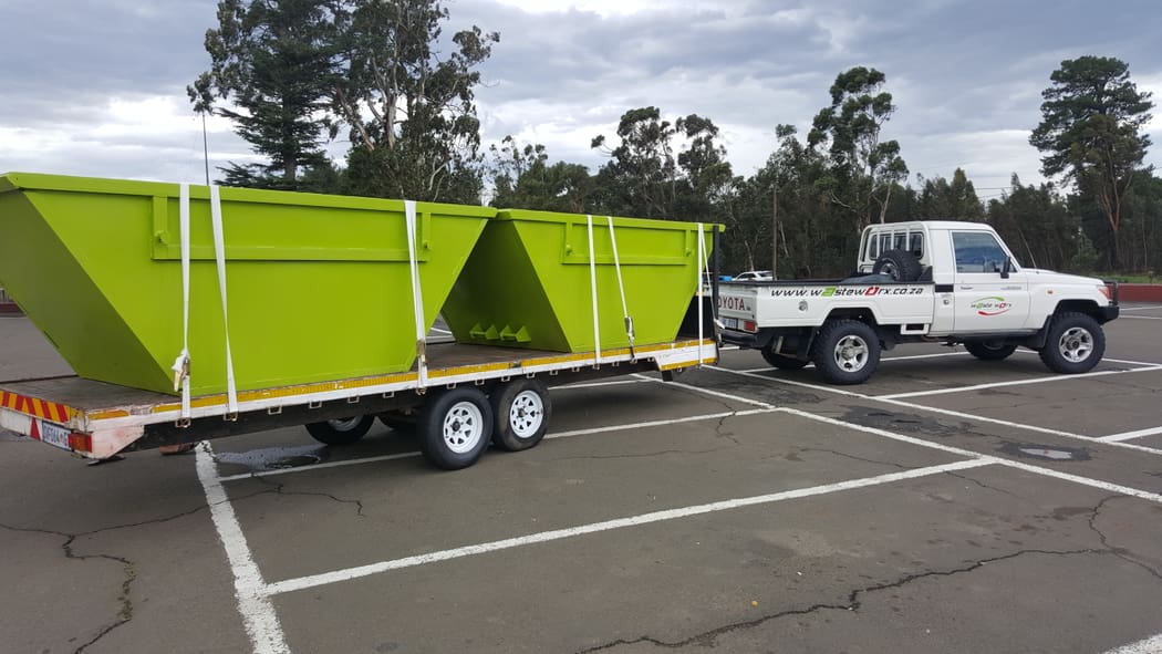 Waste Worx containers being transported on a trailer