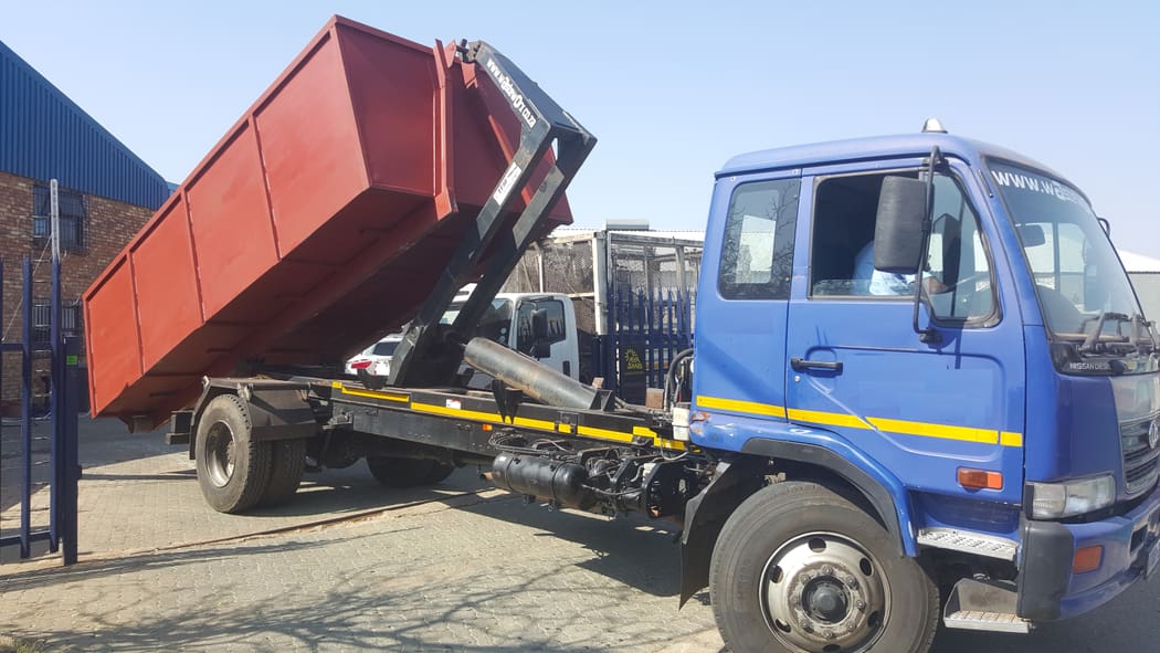 Waste Worx truck lifting a bulk waste container